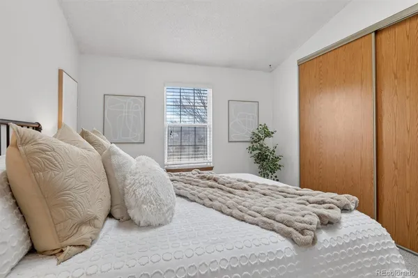 a large white bed in a white room