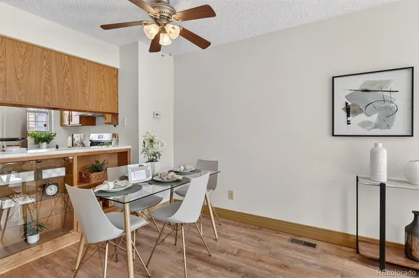 a view of a dining room with furniture window and wooden floor