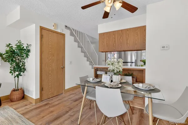 a view of a dining room with furniture window and wooden floor