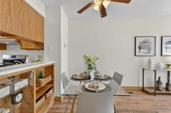 a kitchen with stainless steel appliances granite countertop a sink a stove and a cabinets