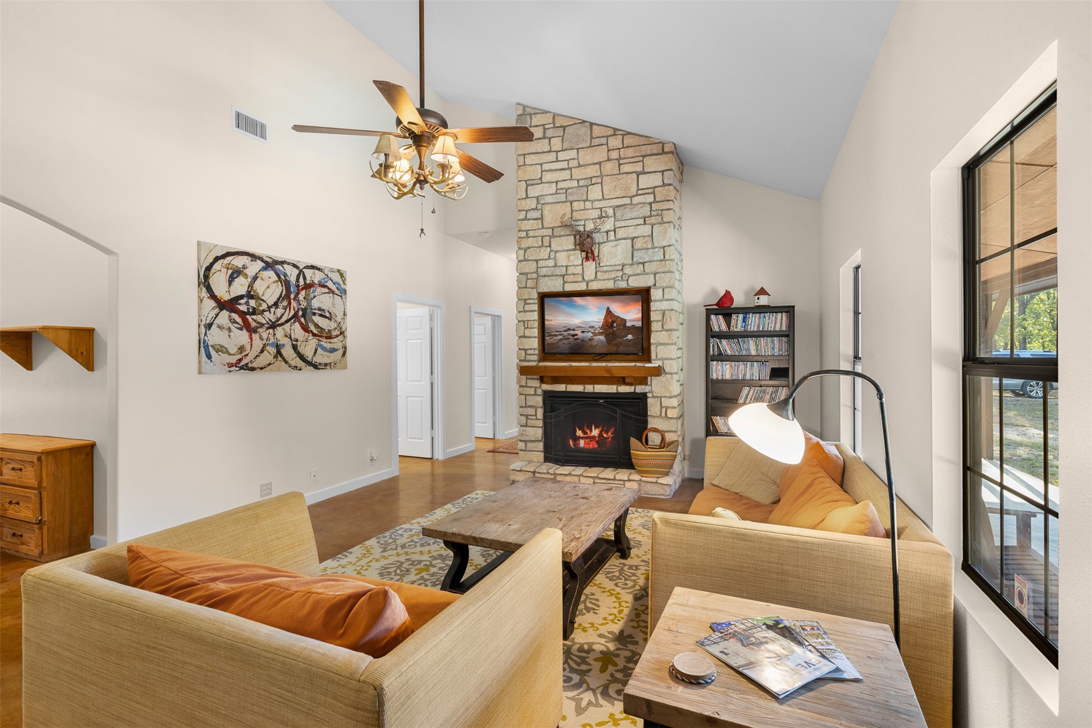 Spacious living room with stone fireplace