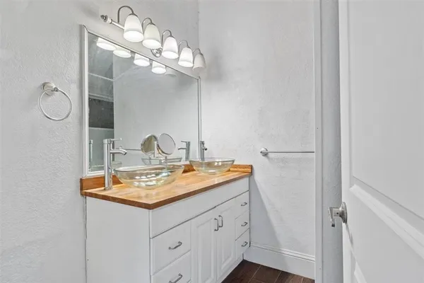 a bathroom with a sink a vanity and mirror