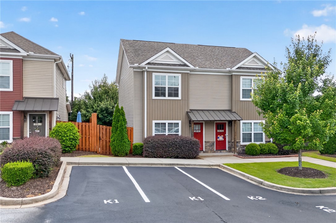 235 Pendleton Road, Unit K1 Clemson, SC 29631 - Photo 38 of 49 Two-story siding and stone exteriors define this contemporary duplex, complete with ample parking and verdant landscaping.