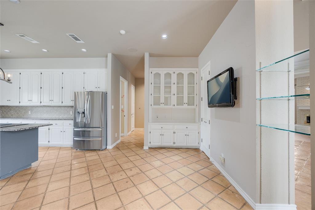 1201 Findlay Drive Arlington, TX 76012 - Photo 17 of 35 a kitchen with stainless steel appliances a refrigerator and a stove top oven