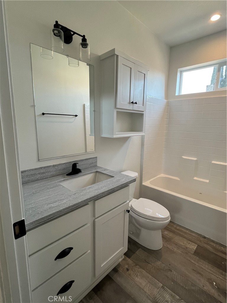 1550 Rimpau Avenue, Unit 42 Corona, CA 92881 - Photo 10 of 22 a bathroom with a sink toilet and shower