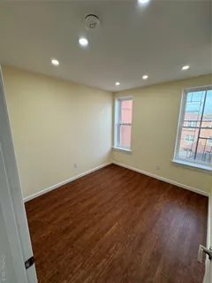 a kitchen with kitchen island a sink stainless steel appliances and cabinets