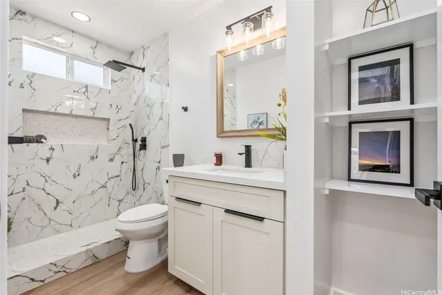 a bathroom with a sink toilet and shower