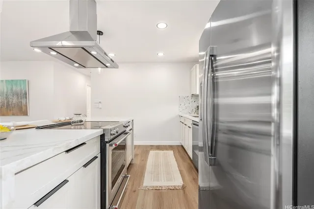 a kitchen with a sink and refrigerator