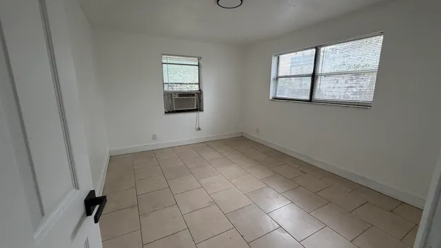 an empty room with windows