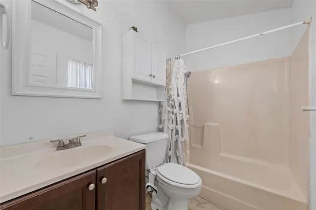 a kitchen with granite countertop a sink stainless steel appliances and cabinets