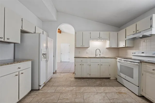 a view of a backyard with trees