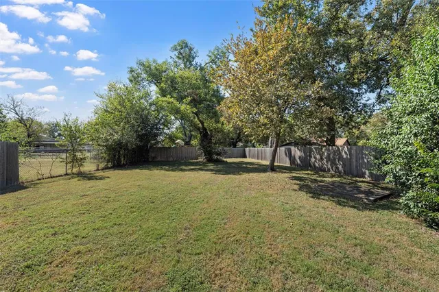 an aerial view of a house with garden space and sitting space