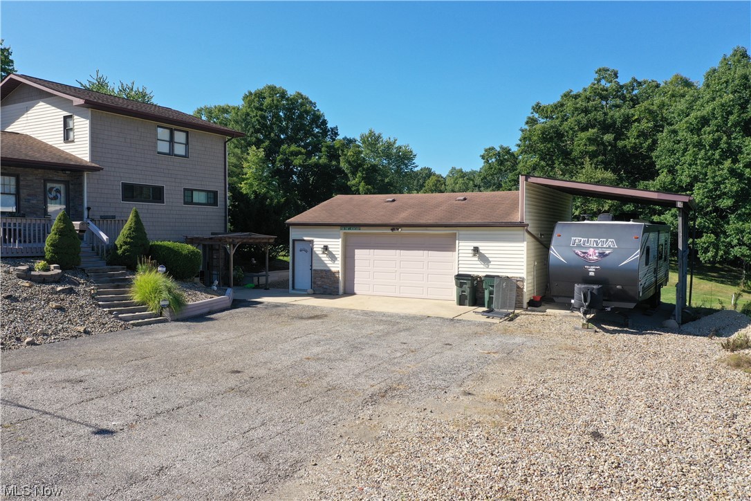 6755 State Rte 5 Ravenna, OH 44266 - Photo 2 of 34 View of front facade with garage and carport