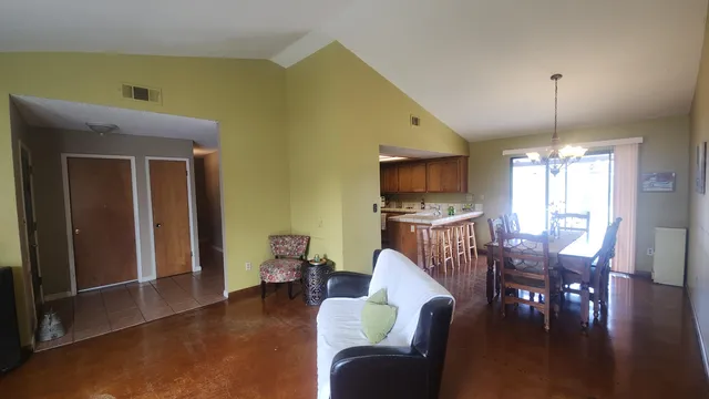 a view of a livingroom with furniture window and wooden floor