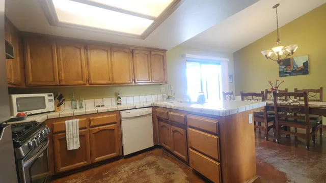 a kitchen with a sink stove and cabinets