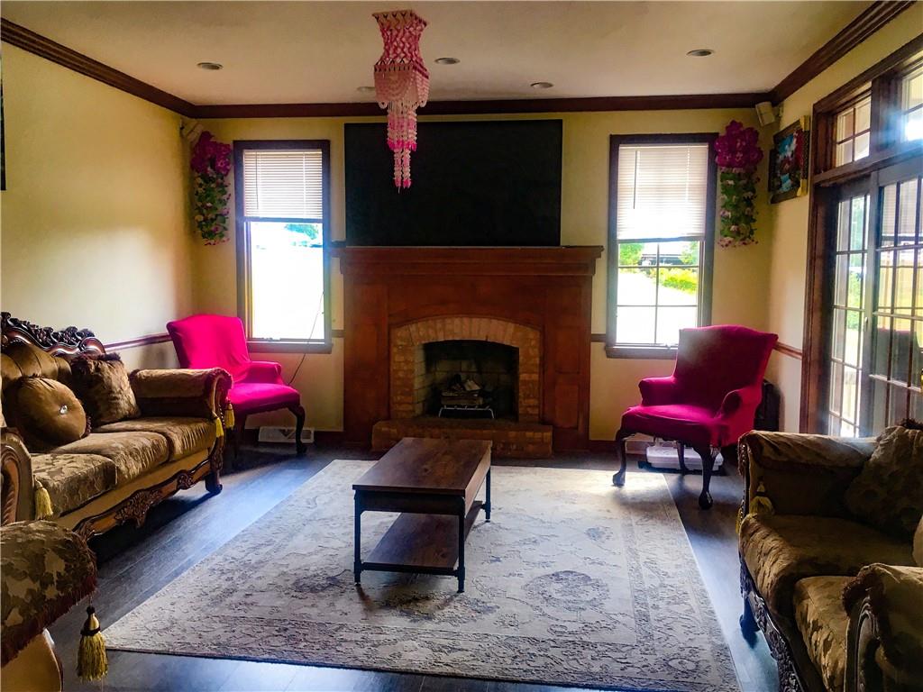 5076 Brownsville Road Pittsburgh, PA 15236 - Photo 15 of 50 a living room with furniture window and a fireplace
