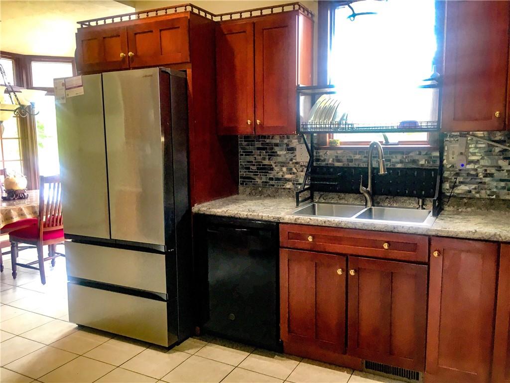 5076 Brownsville Road Pittsburgh, PA 15236 - Photo 21 of 50 a kitchen with a sink and cabinets