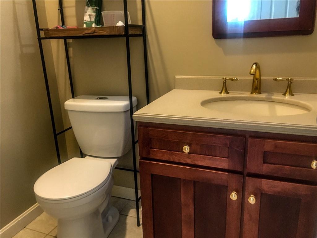 5076 Brownsville Road Pittsburgh, PA 15236 - Photo 22 of 50 a white toilet sitting next to a bathroom sink