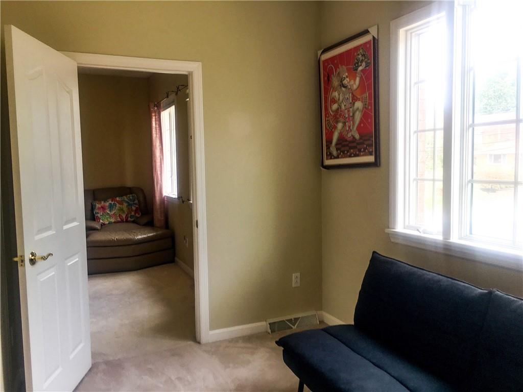 5076 Brownsville Road Pittsburgh, PA 15236 - Photo 23 of 50 a living room with furniture and a window