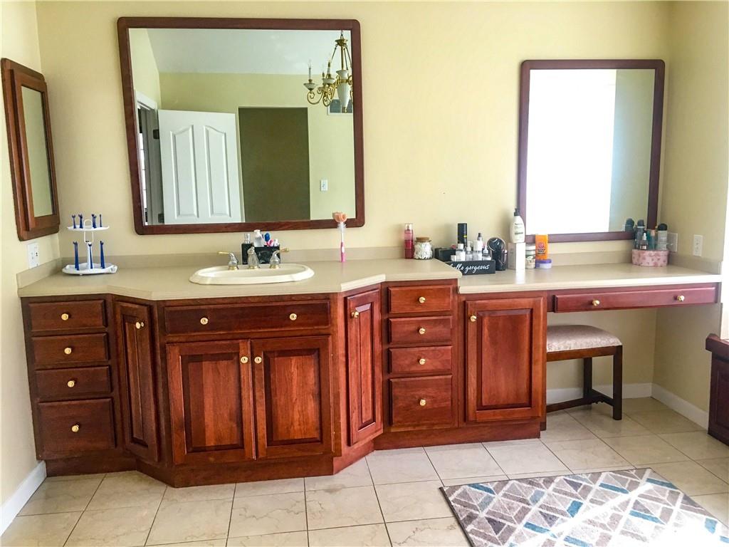 5076 Brownsville Road Pittsburgh, PA 15236 - Photo 29 of 50 a spacious bathroom with a double vanity sink and a mirror
