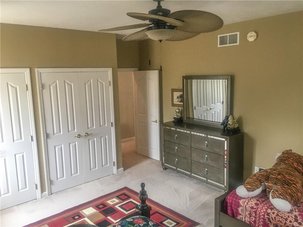5076 Brownsville Road Pittsburgh, PA 15236 - Photo 31 of 50 a bedroom with a bed and a dresser