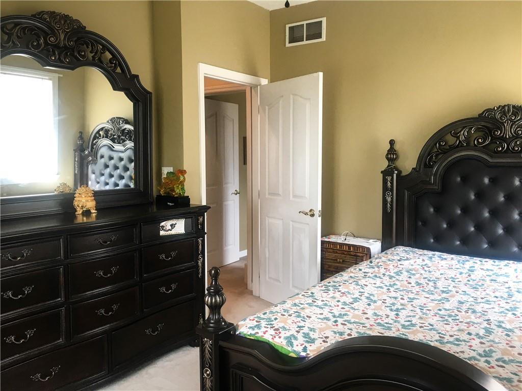 5076 Brownsville Road Pittsburgh, PA 15236 - Photo 32 of 50 a bedroom with a bed and a dresser