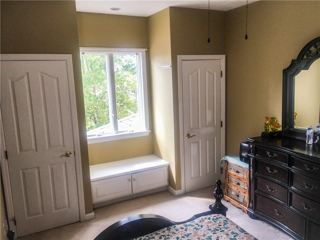 5076 Brownsville Road Pittsburgh, PA 15236 - Photo 33 of 50 a bedroom with a dresser and a window