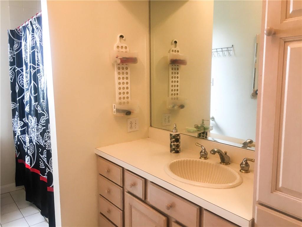 5076 Brownsville Road Pittsburgh, PA 15236 - Photo 34 of 50 a bathroom with a sink and a mirror