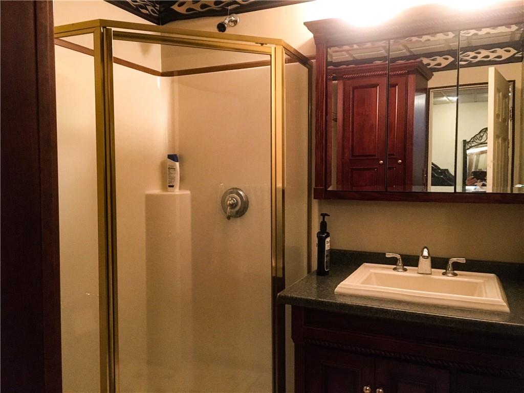 5076 Brownsville Road Pittsburgh, PA 15236 - Photo 38 of 50 a bathroom with a sink and mirror