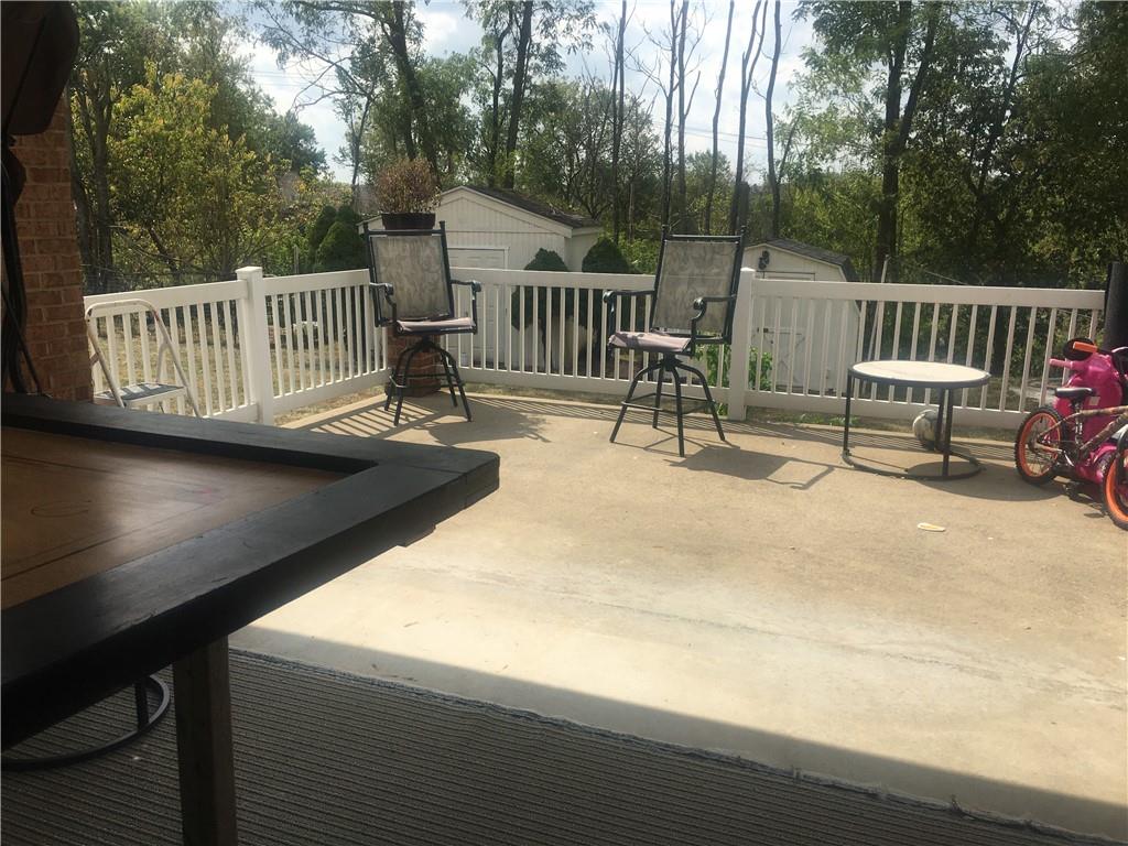 5076 Brownsville Road Pittsburgh, PA 15236 - Photo 40 of 50 a view of a patio with a table and chairs