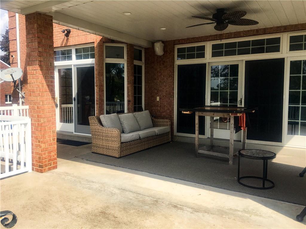 5076 Brownsville Road Pittsburgh, PA 15236 - Photo 42 of 50 a living room with furniture windows and a flat screen tv