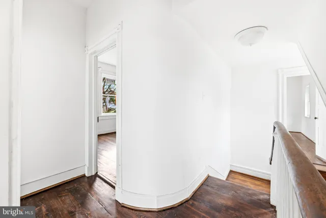 a view of a room with wooden floor and chair
