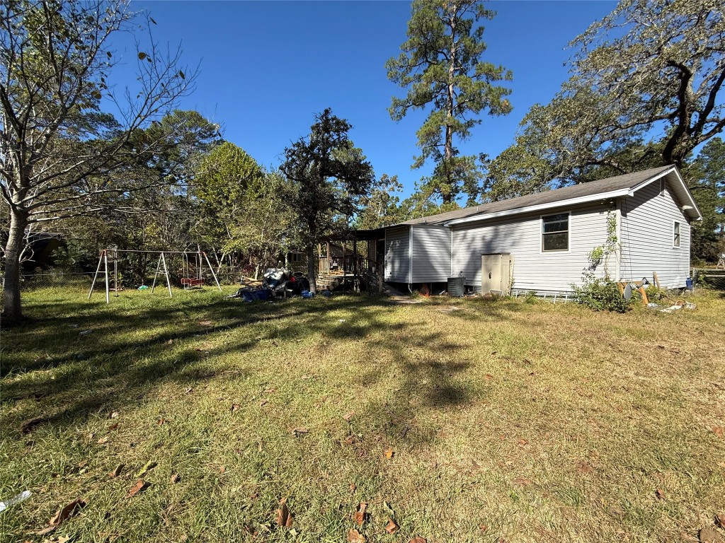 26457 Easy Street Magnolia, TX 77355 - Photo 2 of 15 a view of a house with a yard