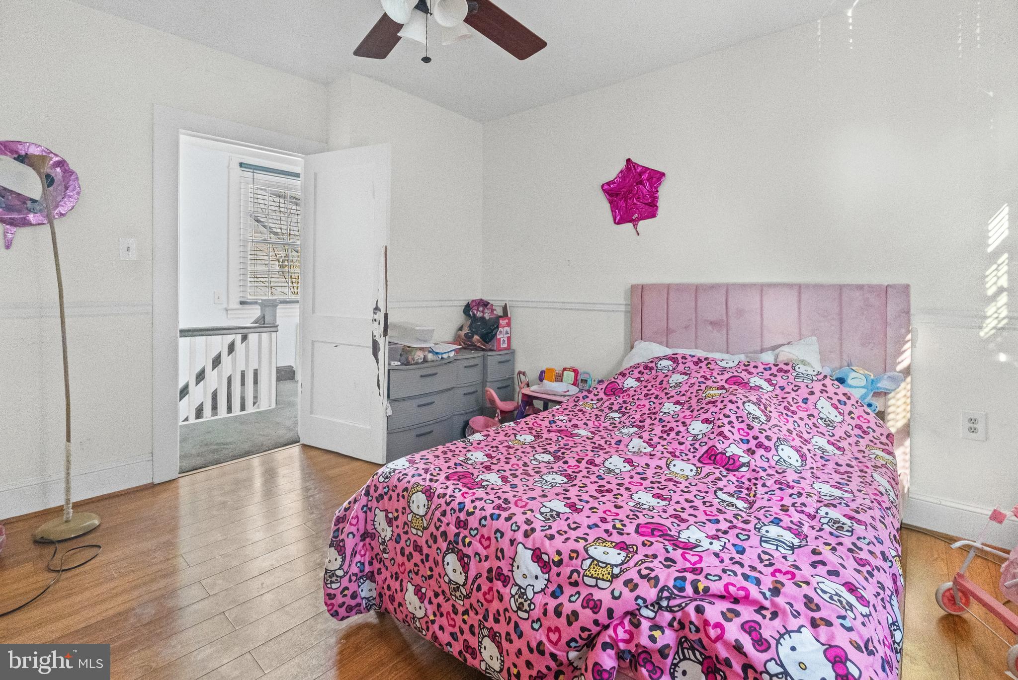 3804 Ridgecroft Road Baltimore, MD 21206 - Photo 12 of 23 a bedroom with a bed and a dresser