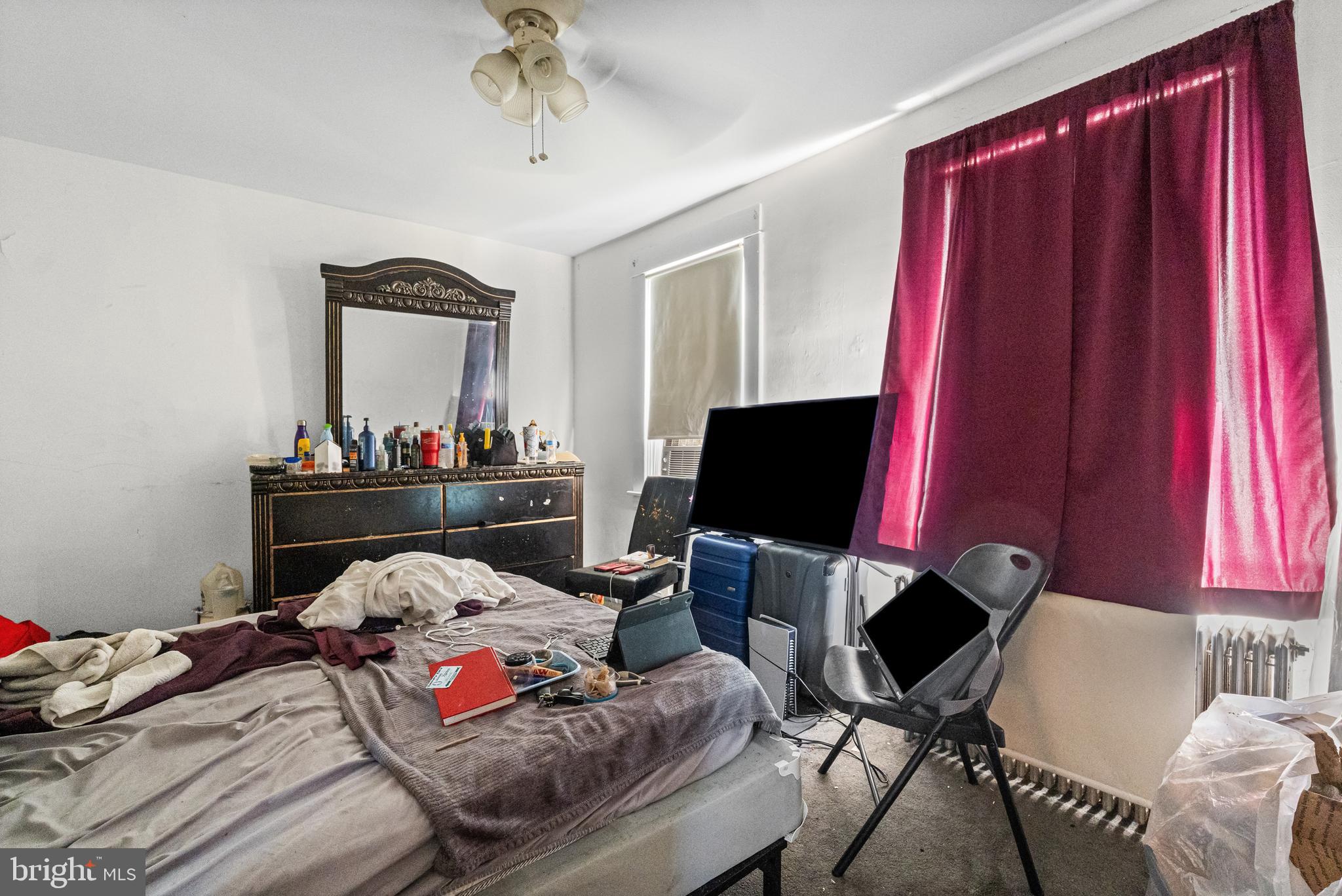 3804 Ridgecroft Road Baltimore, MD 21206 - Photo 13 of 23 a bedroom with a bed and a window