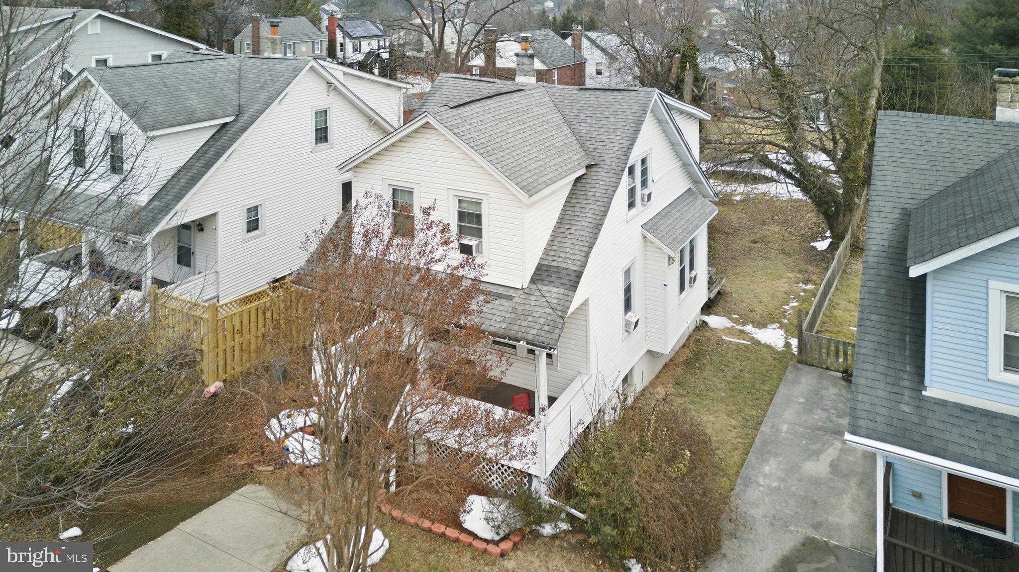 3804 Ridgecroft Road Baltimore, MD 21206 - Photo 14 of 21 a view of a white house next to a road