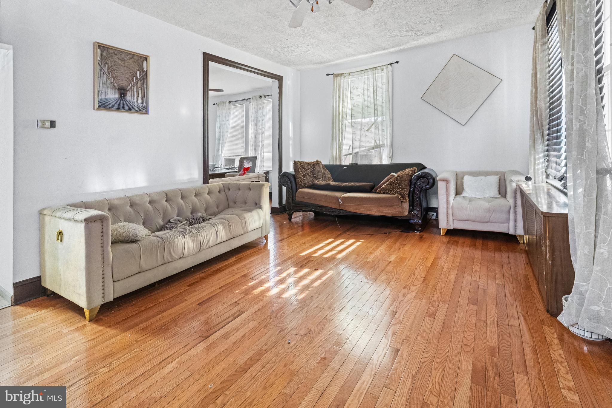 3804 Ridgecroft Road Baltimore, MD 21206 - Photo 3 of 23 a living room with furniture and a wooden floor