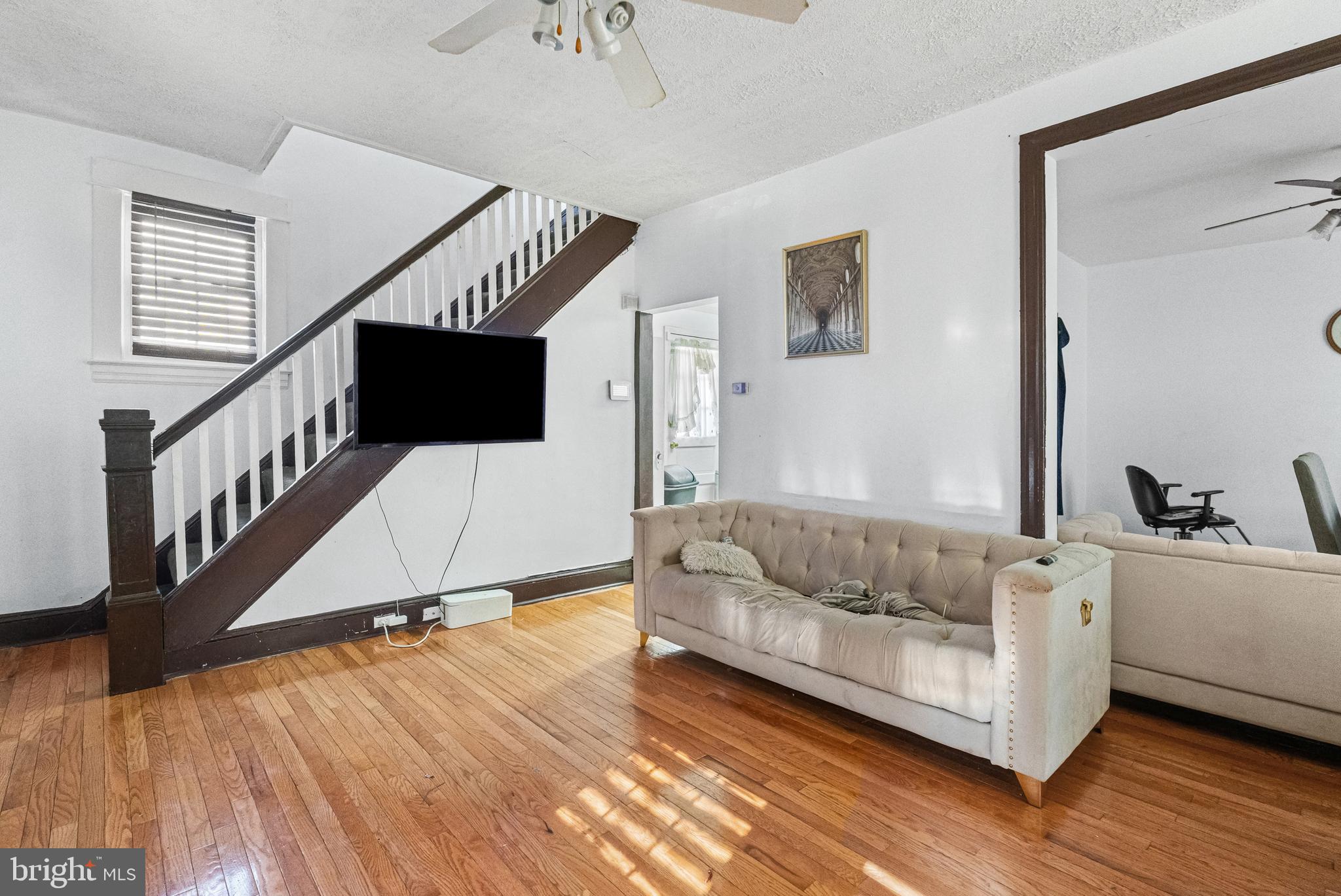 3804 Ridgecroft Road Baltimore, MD 21206 - Photo 4 of 23 a living room with furniture and a wooden floor