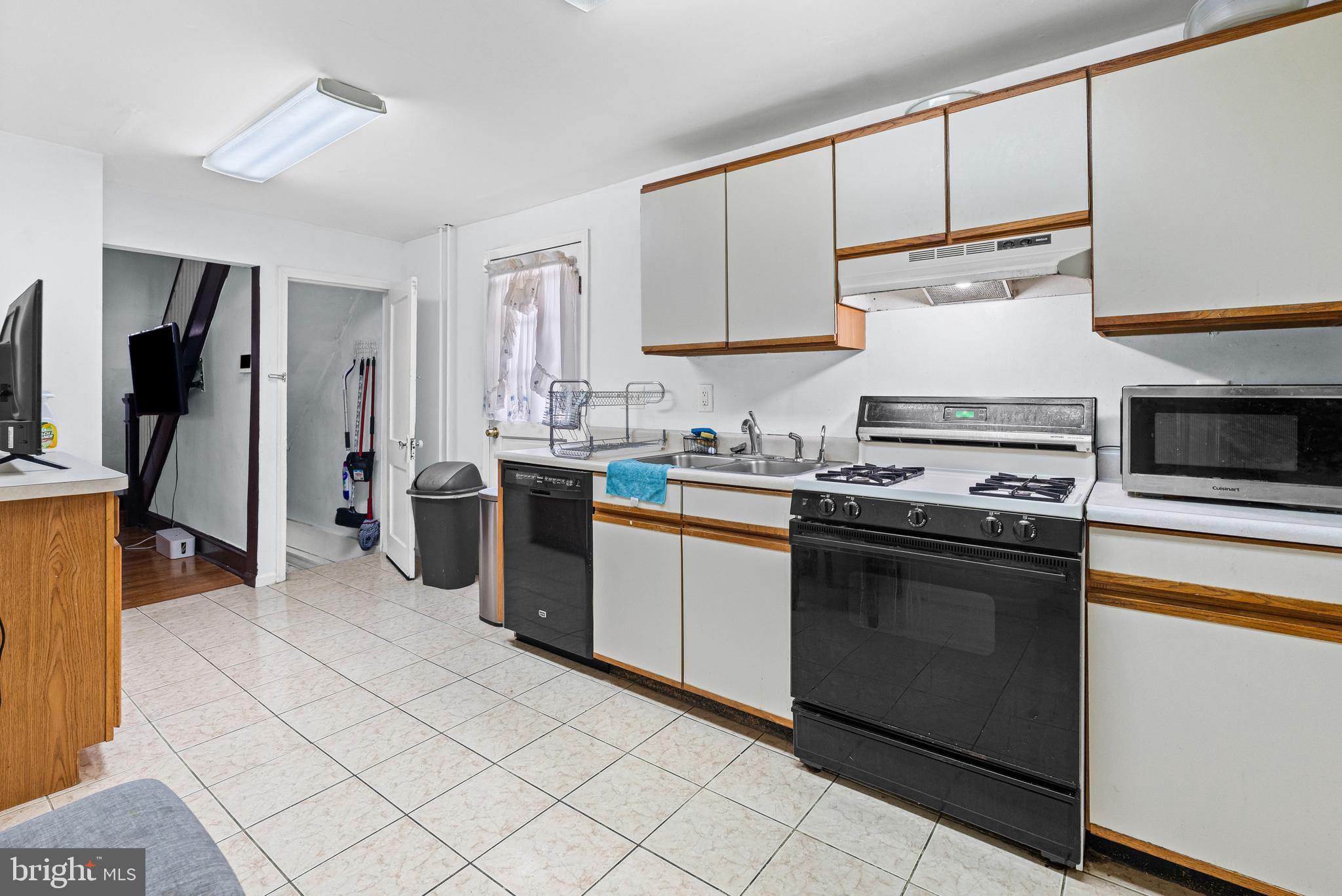 3804 Ridgecroft Road Baltimore, MD 21206 - Photo 6 of 23 a kitchen with stainless steel appliances granite countertop a stove a sink and a refrigerator