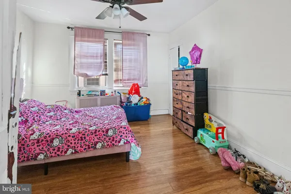 a bedroom with bed and a window