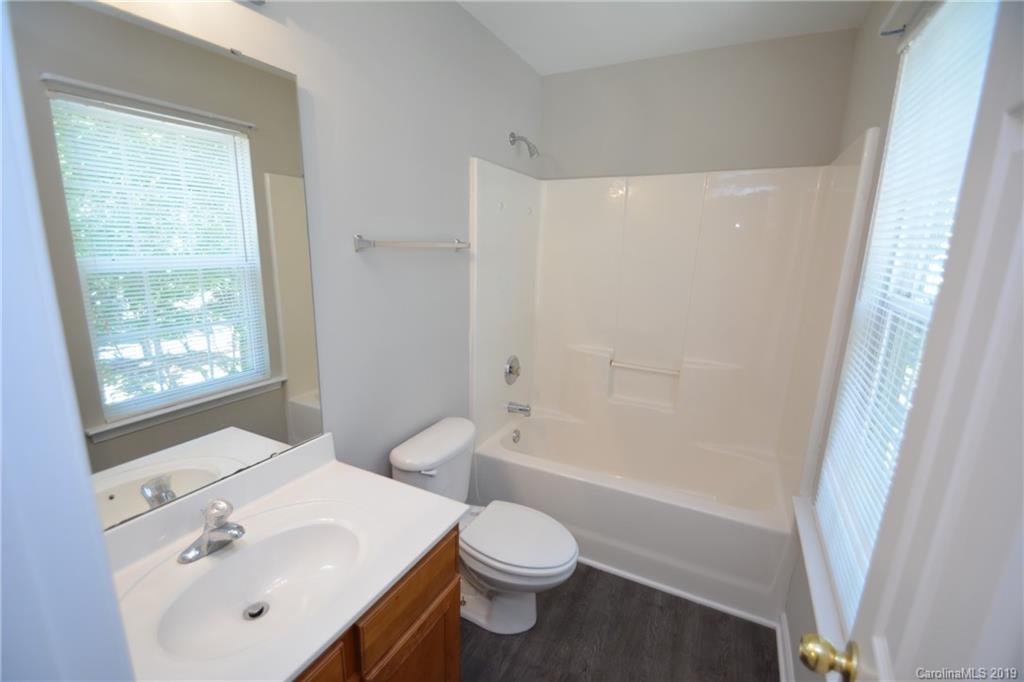 10044 Caldwell Depot Road Cornelius, NC 28031 - Photo 11 of 16 a bathroom with a sink a toilet and shower