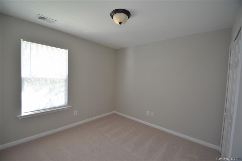 10044 Caldwell Depot Road Cornelius, NC 28031 - Photo 12 of 16 an empty room with a window