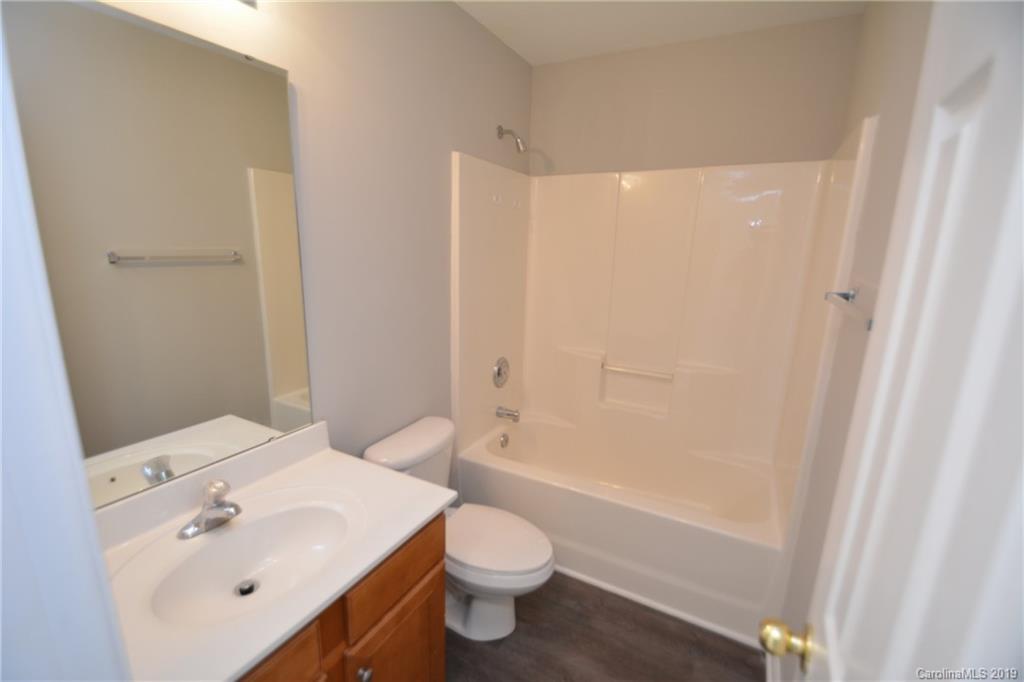 10044 Caldwell Depot Road Cornelius, NC 28031 - Photo 14 of 16 a bathroom with a sink a toilet and shower