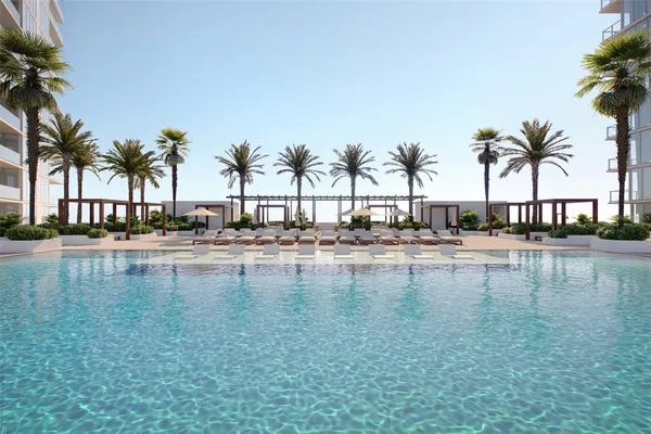a view of swimming pool with outdoor seating