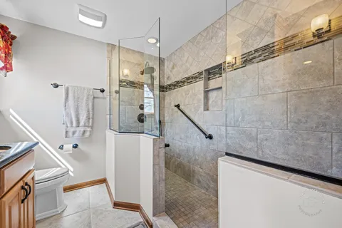 a bathroom with a shower and a sink