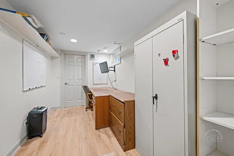a view of kitchen with furniture and wooden floor