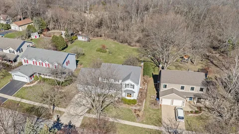 a aerial view of residential houses with outdoor space