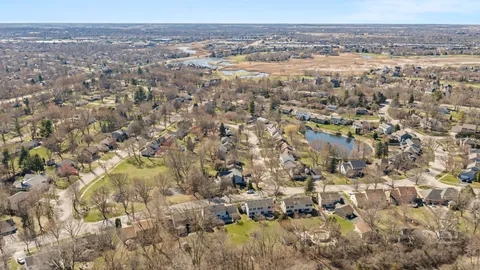 a view of residential houses with yard