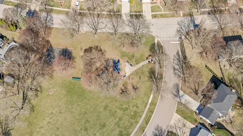 a picture of a room with a white wall and a refrigerator