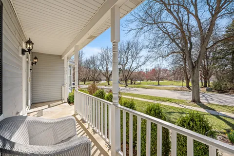 a view of a balcony with trees